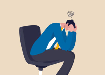 Regret on business mistake, frustration or depressed, stupidity or foolish losing all money, stressed and anxiety on failure concept, frustrated businessman holding his head sitting alone on the chair